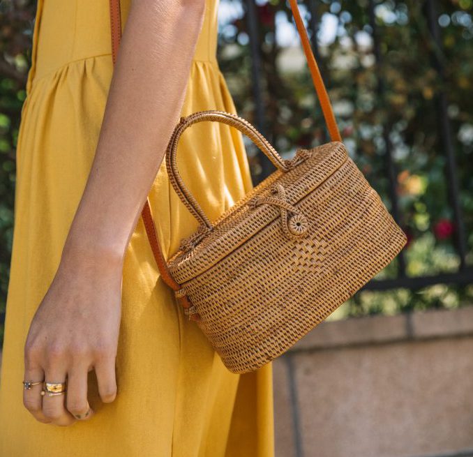 Cute and dainty, the woven TAN CYLINDER CROSSBODY BAG by Street Level