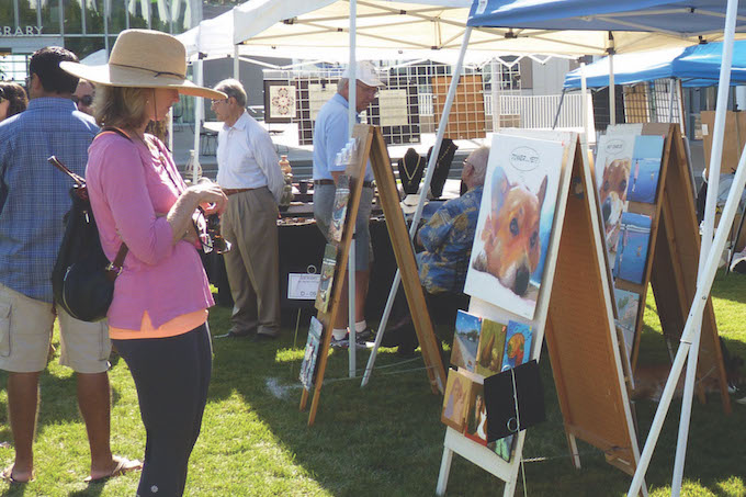 AITP attendee viewing paintings 4-14-14 crop_edited-1 (1)_Courtesy of Newport Beach Arts Foundation