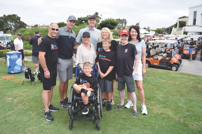 Captain of the Anaheim Ducks Ryan Getzlaf and two local families impacted by Duchenne at the Getzlaf Golf Shootout benefitting CureDuchenne-credit Shanda Venneau